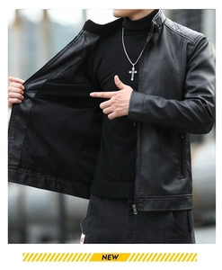 Detail of black motorcycle jacket with stand collar and ribbed knitted cuffs on the sleeve