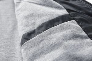 Close-up of lightweight jacket interior showing grey knit lining and ripstop nylon fabric