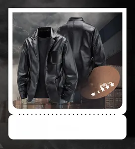 Detail view of black lychee grain faux leather jacket with lapel and button closure