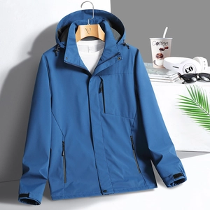 Navy blue waterproof hooded windbreaker jacket with zipper pockets on a wooden hanger