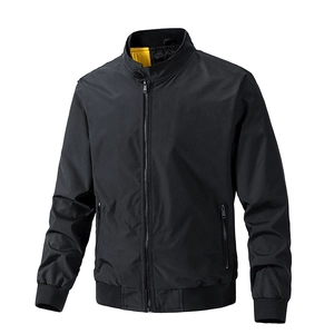 Detail of men's black flight jacket featuring contrast yellow collar lining and metal zipper