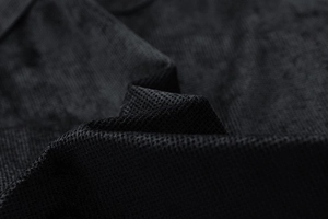 Macro close-up showing the detailed black mesh fabric texture and durable fiber weave