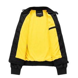 Detail of bomber jacket showing black outer fabric and contrast yellow mesh lining