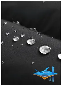 Close-up of waterproof fabric showing water beads with a lotus leaf effect on a black vest