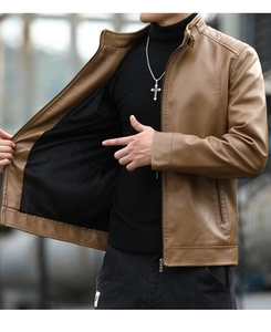 Detail of men's brown faux leather jacket featuring warm black fleece lining and collar