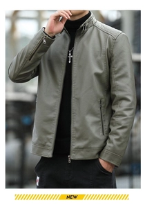 Detail of grey-green biker jacket collar with buckle strap and metallic zippers