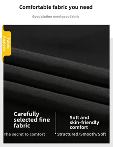 Gros plan détaillé du tissu noir haut de gamme montrant la texture lisse et le drapé