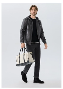 Detail of premium black PU hooded leather jacket with smooth texture and modern casual fit
