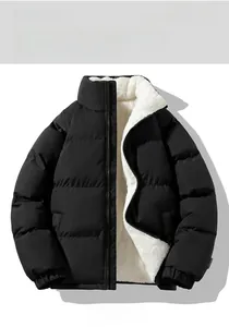 Detail showing matte black puffer jacket with thick white fleece lining and elastic cuff