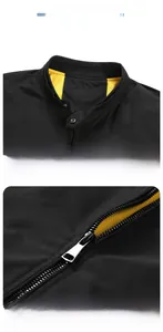 Detail of stand collar with snap buttons and contrasting yellow mesh lining on black jacket