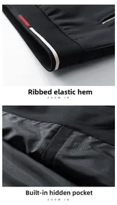 Detail of ribbed hem and inner pocket with geometric lining on black jacket