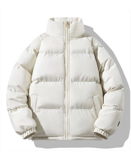 Detailed view of cream-white puffer jacket with quilted padding and a stand-up collar