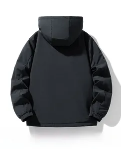 Detail view of black hooded jacket featuring elastic cuffs and windproof tech fabric