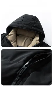 Detail of hooded winter jacket showing khaki contrast lining and metal zipper closure