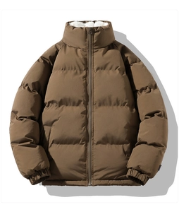Detail of loose winter puffer jacket with stand collar and white lamb wool lining