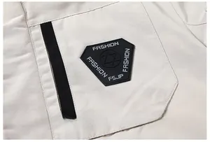 Detail of the parka chest pocket with black fashion patch and fabric texture
