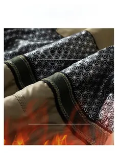 Detail view of khaki jacket featuring graphene self-heating thermal technology inner lining