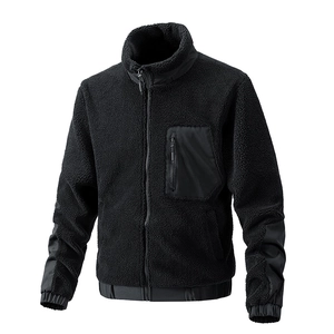 Detailed close-up of a black sherpa fleece jacket with reinforced elbow patches and pocket