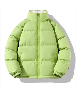 Detail of bright green padded jacket with white fleece collar and checkered cuff label