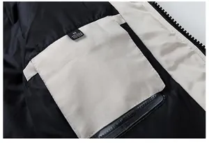 Detail of the black nylon inner lining with a beige pocket and size M label on winter parka