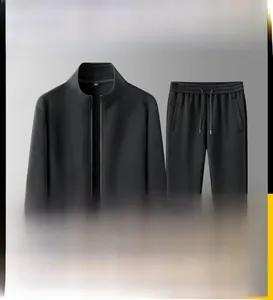 Detail of men's black tracksuit showing high-neck zipper jacket and drawstring sweatpants