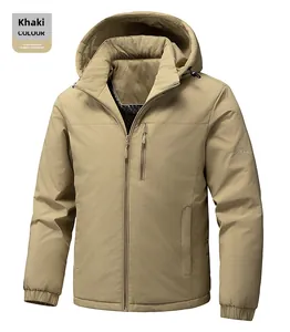 Detail of khaki outdoor jacket with vertical chest zipper and embroidered sleeve logo