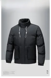 Detail of black winter puffer jacket with stand collar, adjustable drawstrings and flap pockets