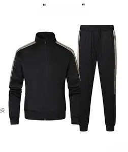 Detail of black sports set with side stripes, zip-up jacket and tapered pants