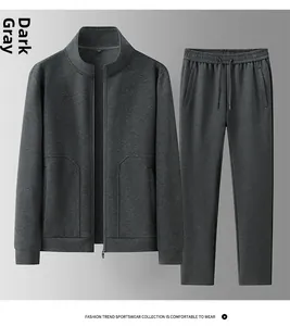 Detail view of dark grey men's sports tracksuit with stand collar zip jacket and pants