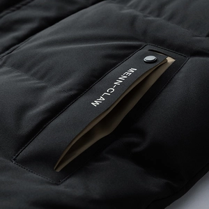 Men winter hooded parka in black featuring quilted fabric and snap pocket detail