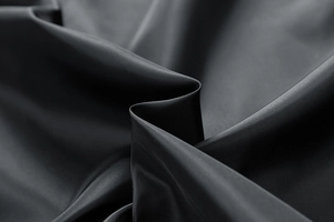 Close-up of black fleece jacket with durable high-density fiber and smooth zipper detail