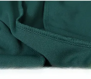 Detail of the high-quality stitching and green knit fabric on men's athletic tracksuit
