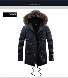 Detail of men's winter parka with thick brown faux fur hood and embroidered arm patch