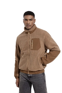 Close-up of brown sherpa fleece jacket featuring stand collar and zipper pocket detail