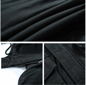 Detailed view of durable twill fabric, metal zipper, and reinforced stitching on jacket