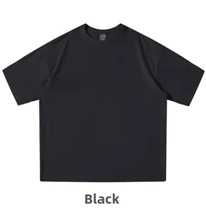 Detail of reinforced crew neck and size label on black loose-fit cotton t-shirt