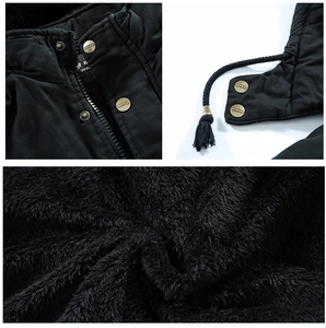 Detail of winter jacket featuring metallic snaps, drawstring hood and plush fleece lining