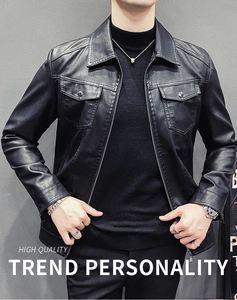 Detail of black faux leather jacket featuring metal zipper and snap button pockets