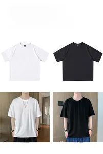 Close-up of relaxed-fit crewneck t-shirts in premium black and white cotton fabric