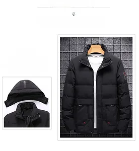 Detail view of black quilted men jacket with detachable hood and sleeve brand patch