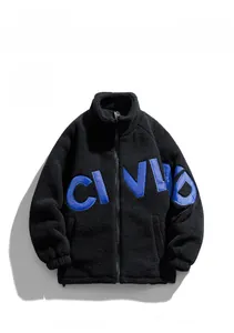 Detail of black fleece jacket featuring blue CIVID letter embroidery and high collar
