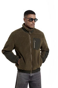 Detail of olive green Sherpa fleece jacket with chest zipper pocket and stand-up collar