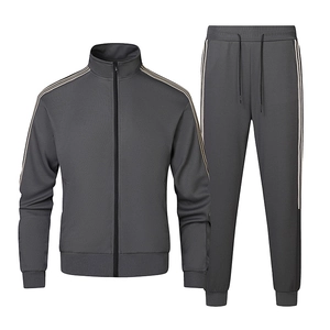 Men's charcoal grey two-piece tracksuit with stand-collar jacket and striped jogger pants