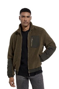 Detail view of olive green fleece jacket showing contrasting patch pockets and zipper