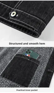 Détail d'une veste en denim noir avec doublure polaire grise, boutons métal et poche interne