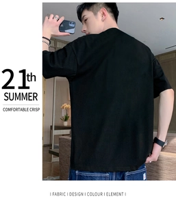 Rear view of minimalist black summer T-shirt with modern typography layout and watch