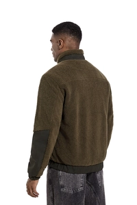 Detail view of the lamb fleece jacket back with green fabric patches on elbows and collar
