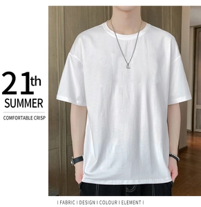 Detail of loose-fit white cotton T-shirt with round neck and dropped shoulder design