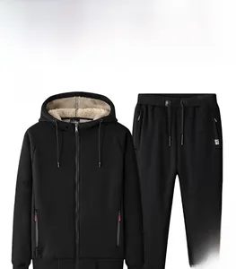 Close-up of the thick beige sherpa fleece lining inside the black hooded tracksuit