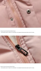 Detail of pink winter puffer jacket featuring double placket buttons and metal zipper closure